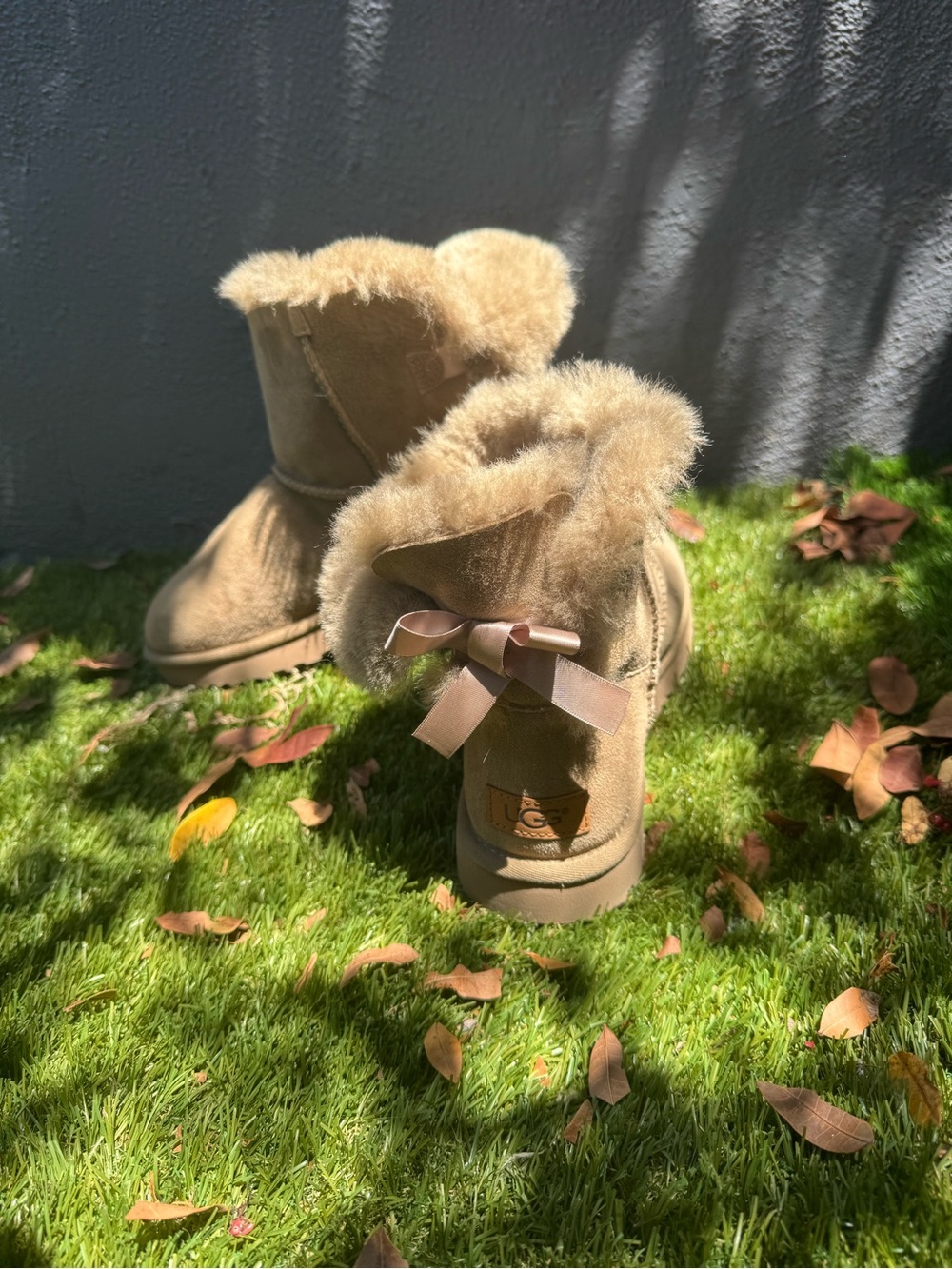 UGG womens Chestnut Suede Boot with Shearling and Back Bow